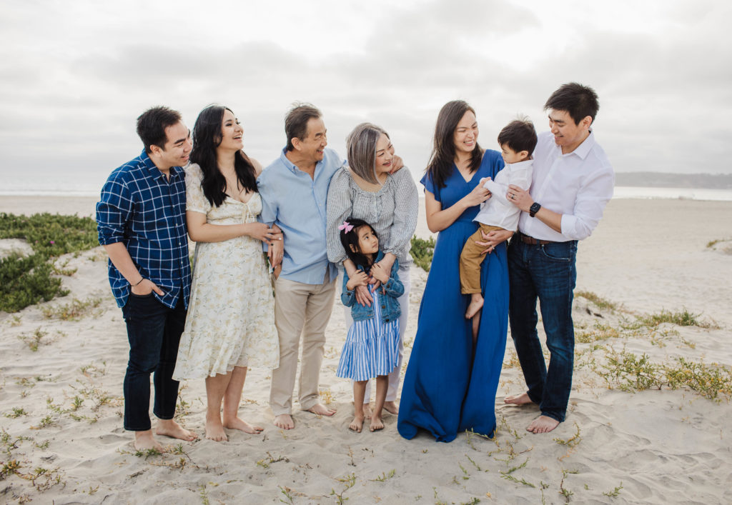 Family taking family photos at Coronado Beach 