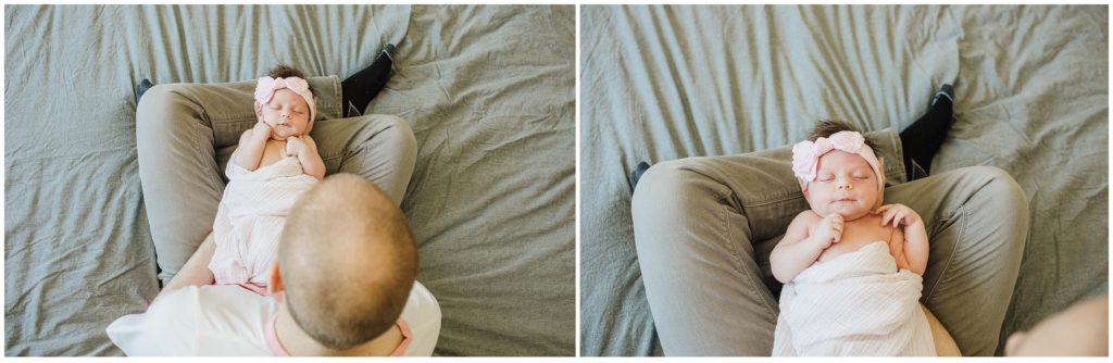 Newborn photography pose with baby laying on dad's lap