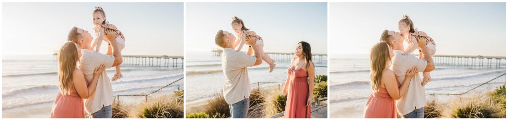 Family taking photos on the beach in La Jolla for a family session