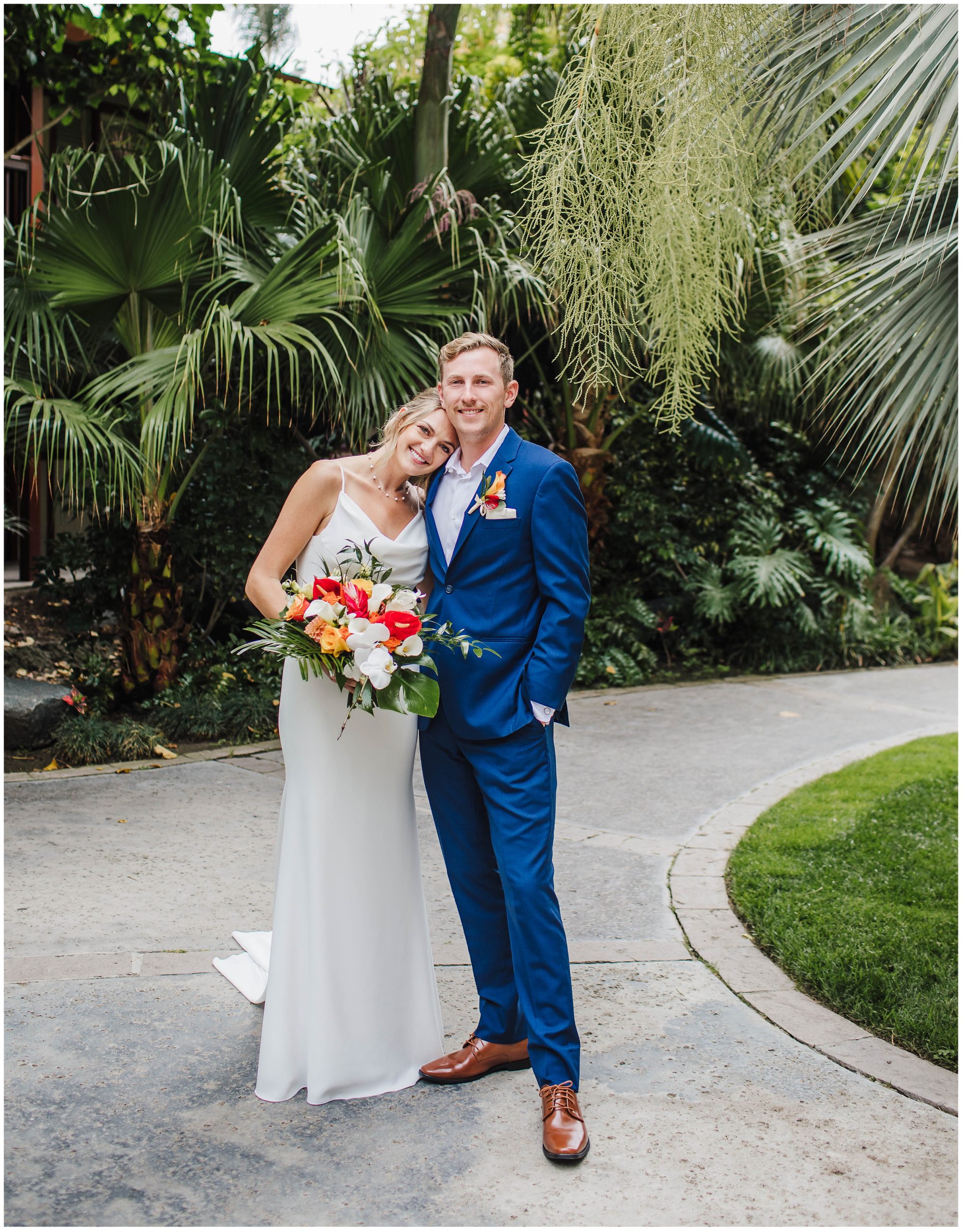 Bride leaning on husband's shoulder during bridal portraits in San Diego
