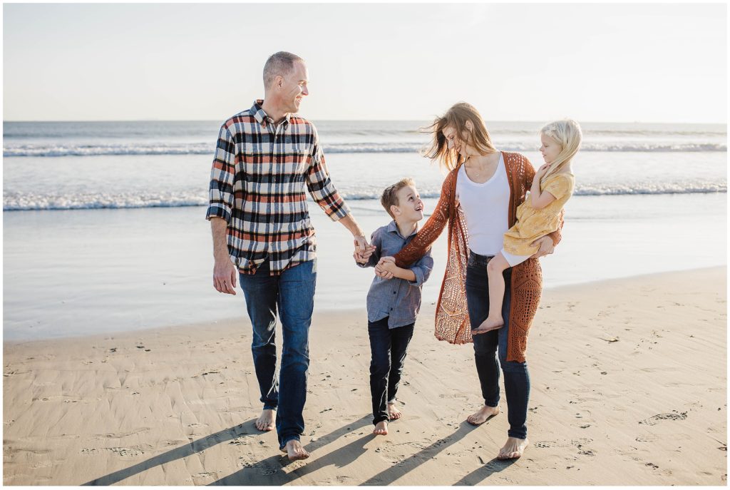 Image depicting must have family photo of family walking on the beach